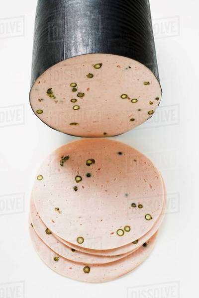 Pfefferwurst (pepper sausage), a piece and slices - Stock Photo - Dissolve