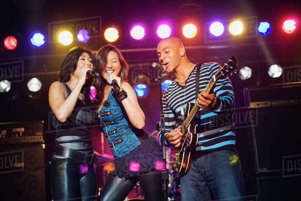 Musical group performing onstage - Stock Photo - Dissolve