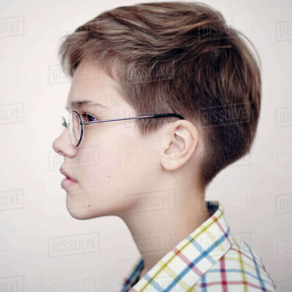 Profile of Caucasian boy wearing eyeglasses Stock Photo Dissolve