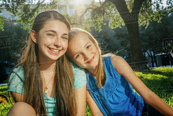 Portrait of smiling Caucasian girls in park - Royalty-free Stock Photo