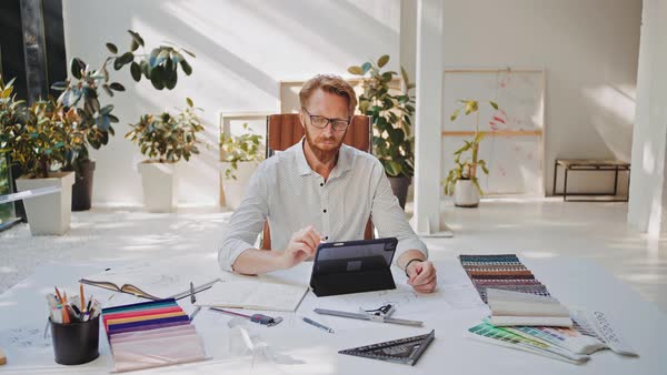 Architect doing sketches on drawing tablet with digital pen 4K