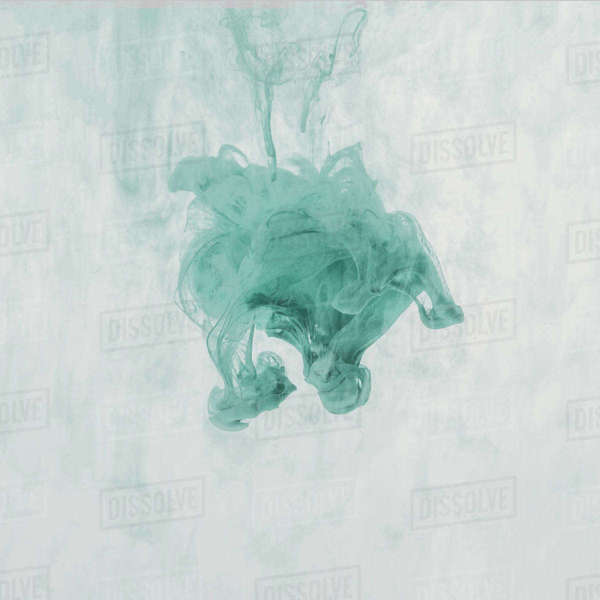 Artistic splash of turquoise paint in water Stock Photo Dissolve