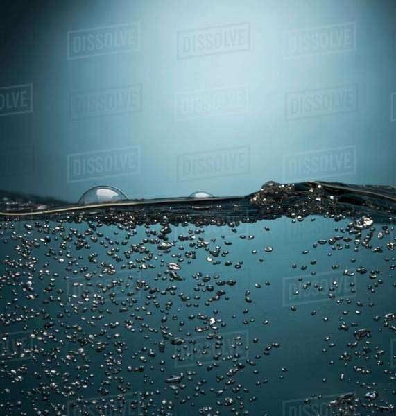Bubbles floating in water Stock Photo Dissolve
