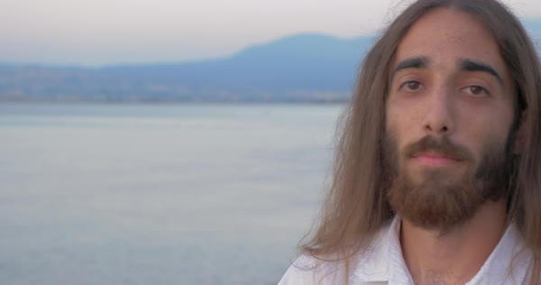 Close Up Shot Of Hipster Style Man With Long Hair And Beard