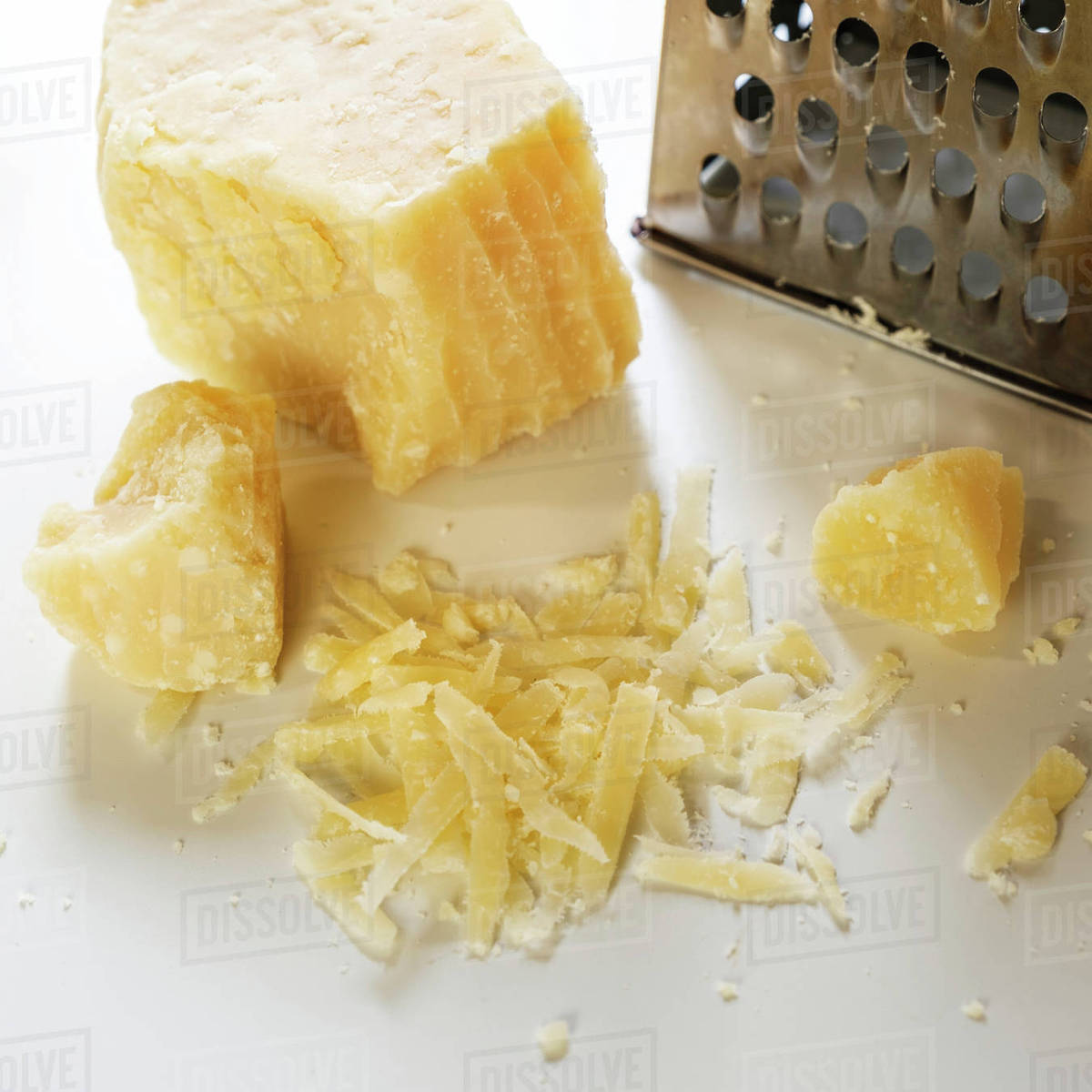 Parmesan cheese and grater Stock Photo Dissolve