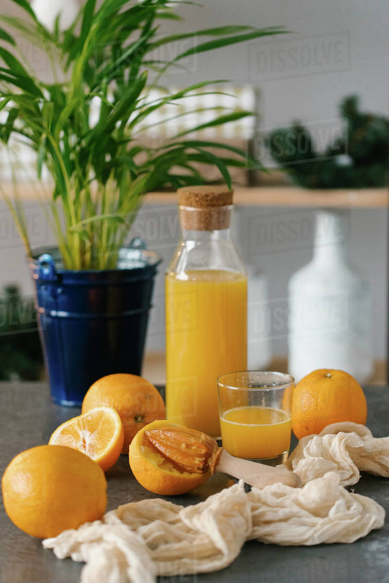 Bottle of homemade orange juice Stock Photo Dissolve