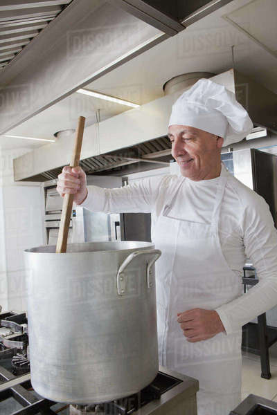 Chef stirring pot - Royalty-free Stock Photo | Dissolve