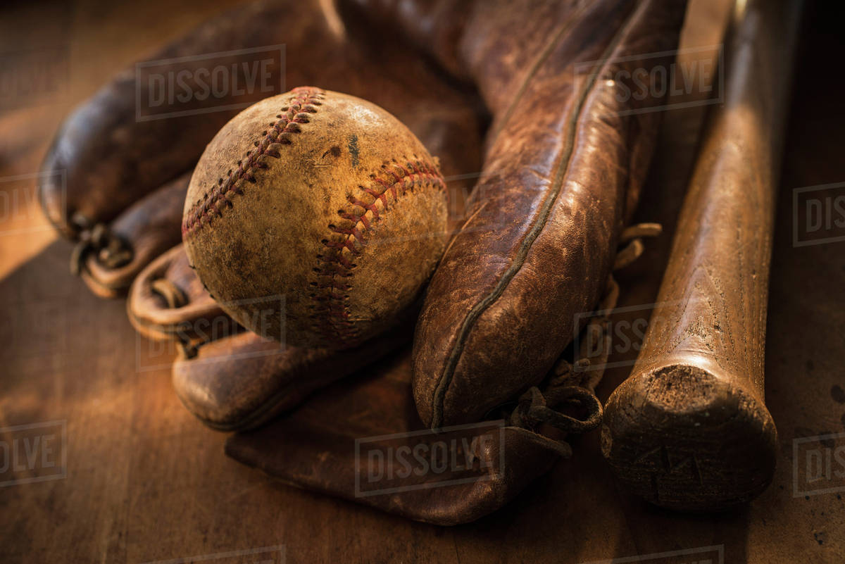 Antique baseball, glove and bat Stock Photo Dissolve