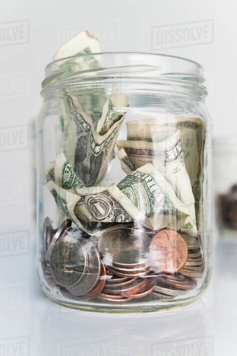 Money in glass jar Stock Photo Dissolve