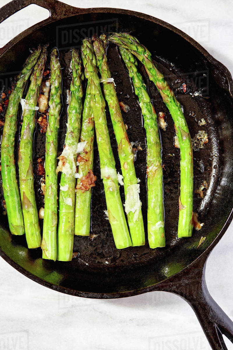 Asparagus in cast iron skillet Stock Photo Dissolve