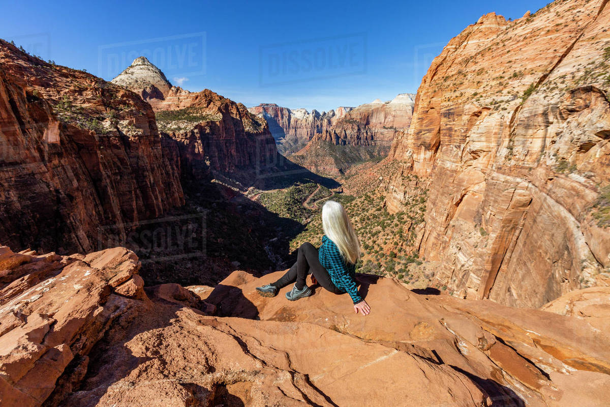 United States, Utah, Zion National Park, Senior woman at overlook above