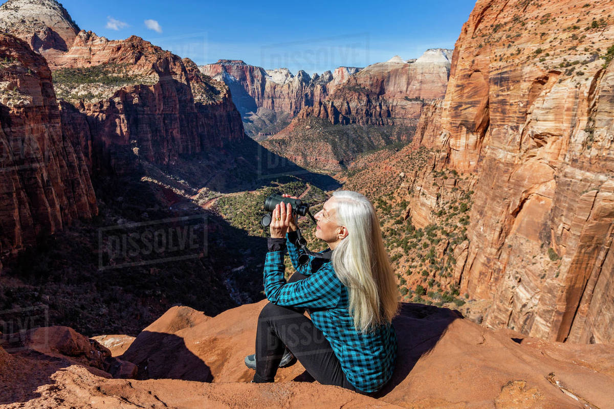 United States, Utah, Zion National Park, Senior woman at overlook above