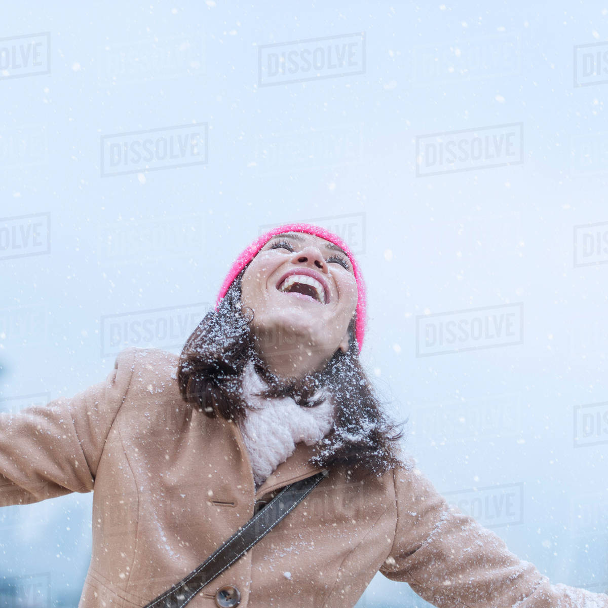 Woman in snowfall Stock Photo Dissolve
