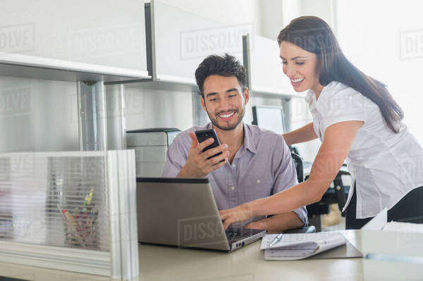 Business man and woman at work in office - Stock Photo - Dissolve