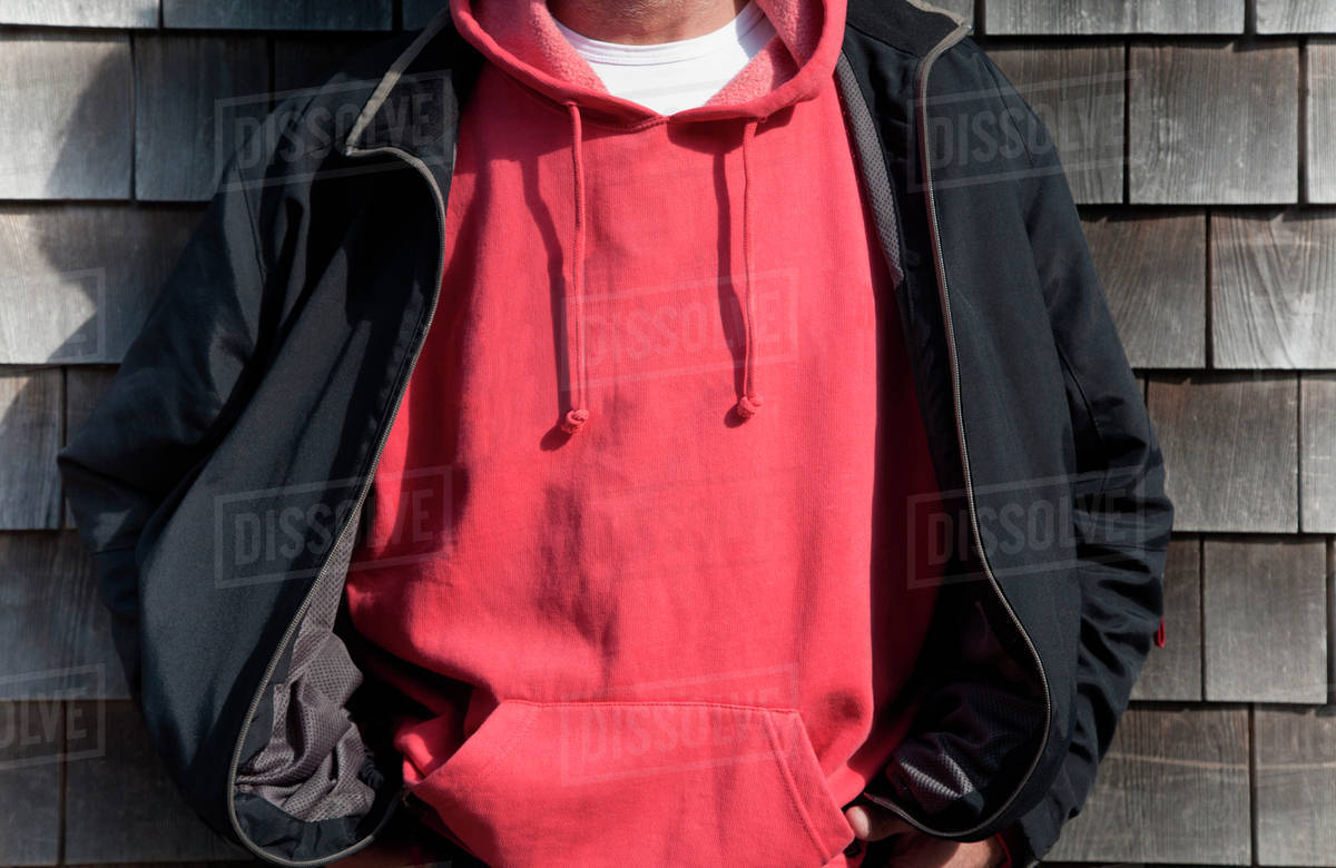 Man wearing red hooded shirt Stock Photo Dissolve