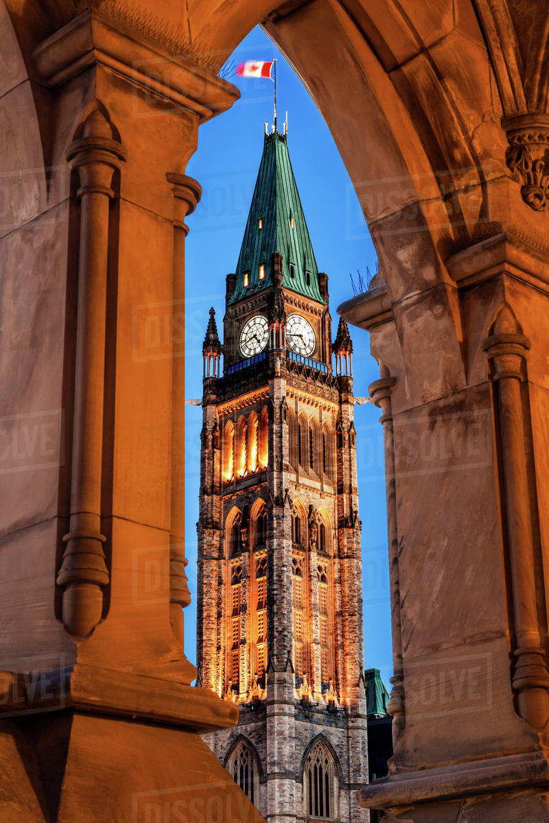Illuminated Peace Tower seen through lancet arch Stock Photo Dissolve