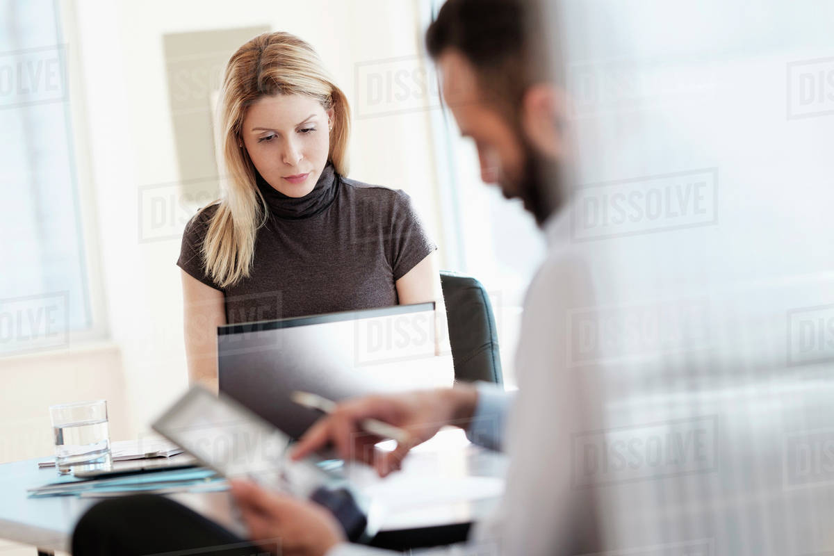 Man and woman working in office - Stock Photo - Dissolve