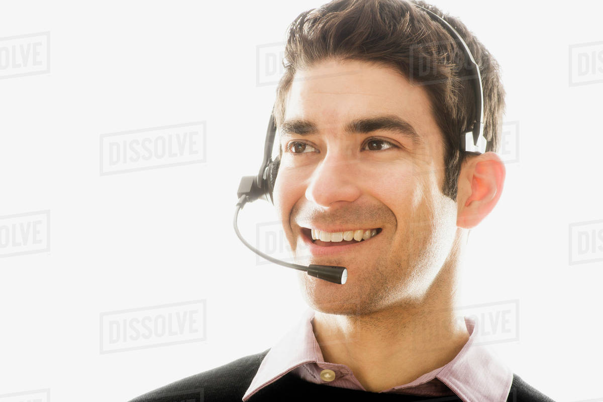 Studio portrait of man wearing headset Stock Photo Dissolve