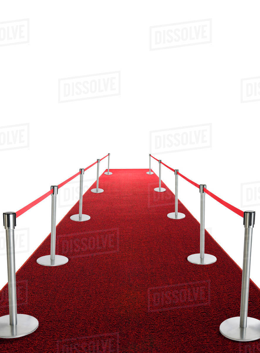 Studio shot of red carpet with stanchions and velvet rope - Stock Photo