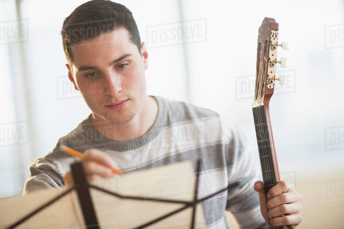 Man composing music Stock Photo Dissolve