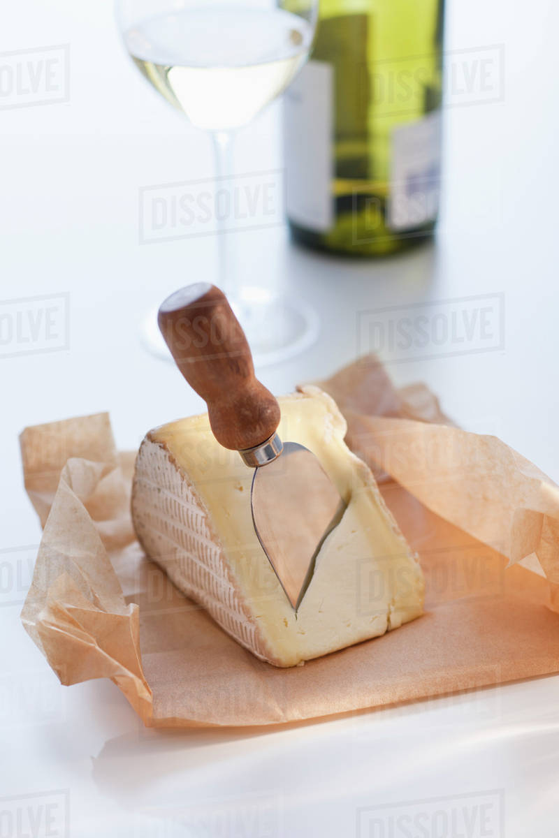 Slice of brie with cheese knife Stock Photo Dissolve