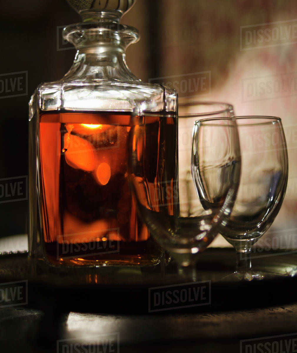 Whiskey in decanter with glasses Stock Photo Dissolve