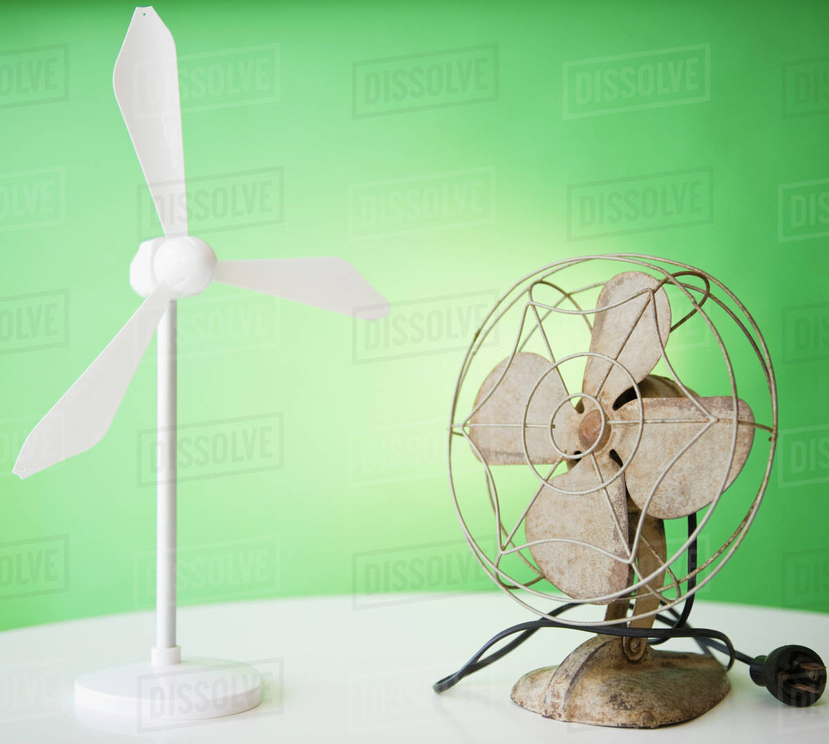 Close up of model of wind turbine and vintage electric fan Stock