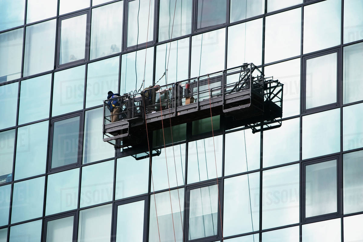 USA, New York City, Manhattan, window cleaning platform on building - Stock  Photo - Dissolve