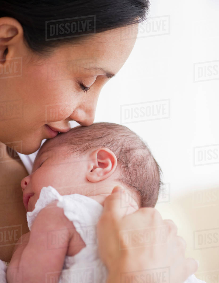 mother kiss baby
