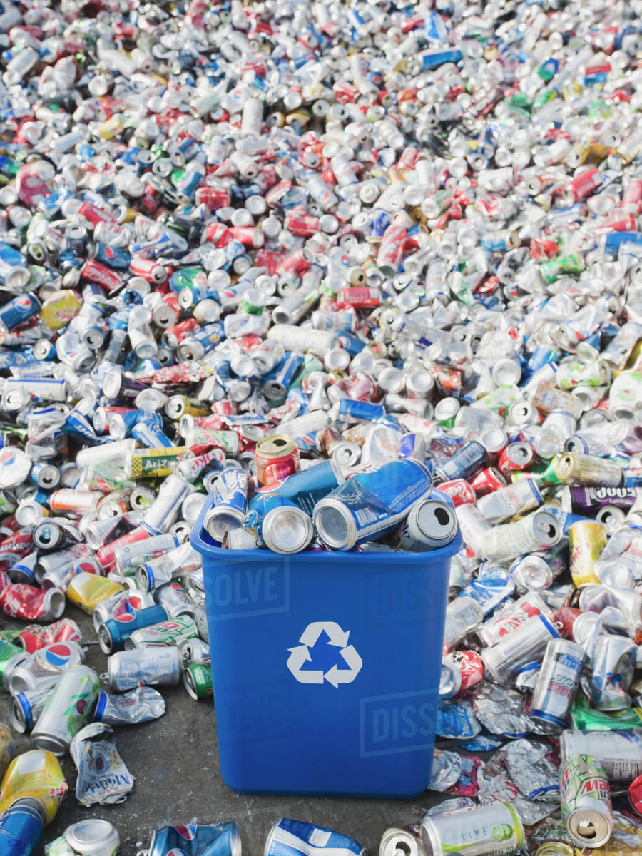 Pile of aluminum cans at recycling plant Stock Photo Dissolve