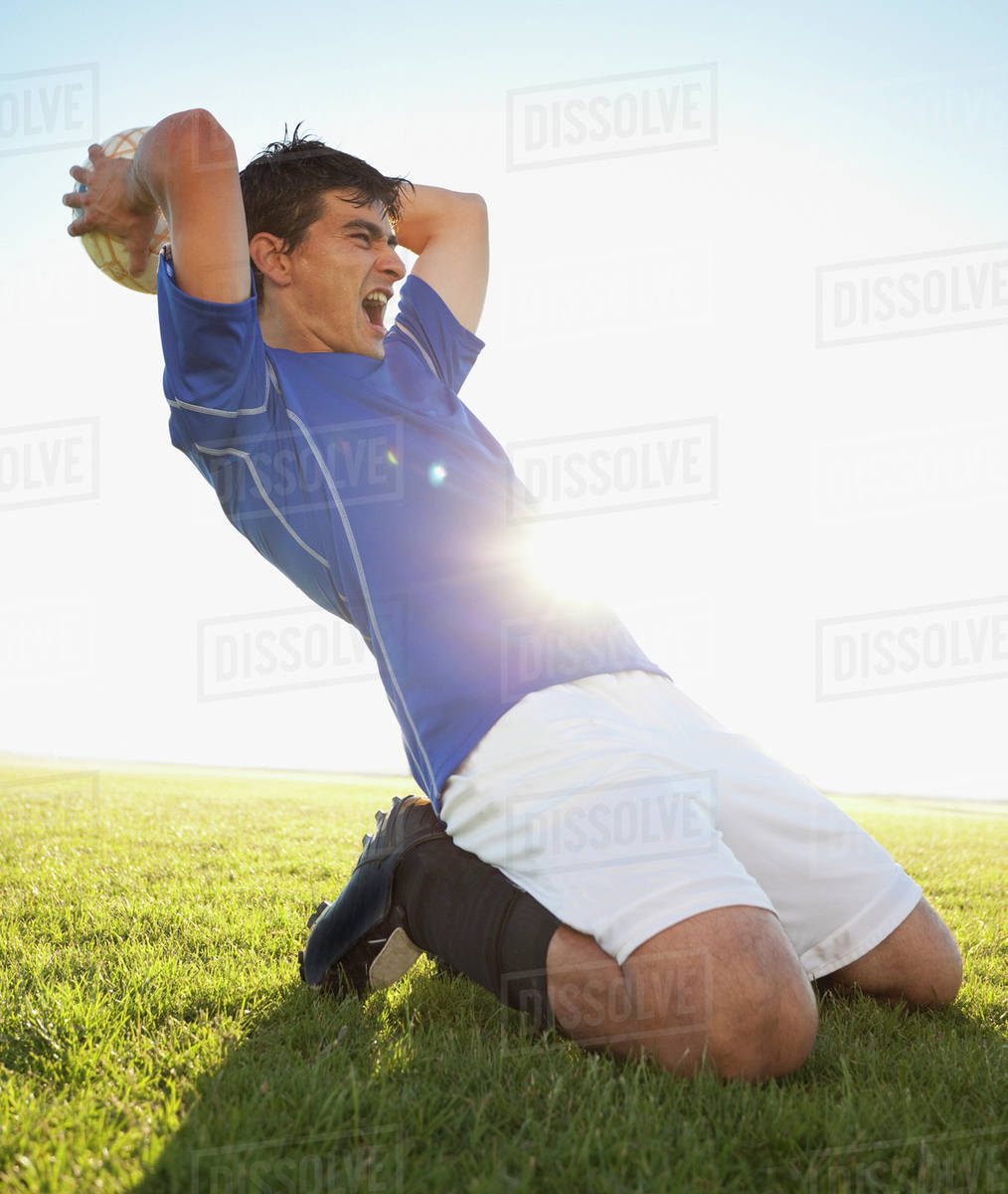 Soccer player throwing ball Stock Photo Dissolve
