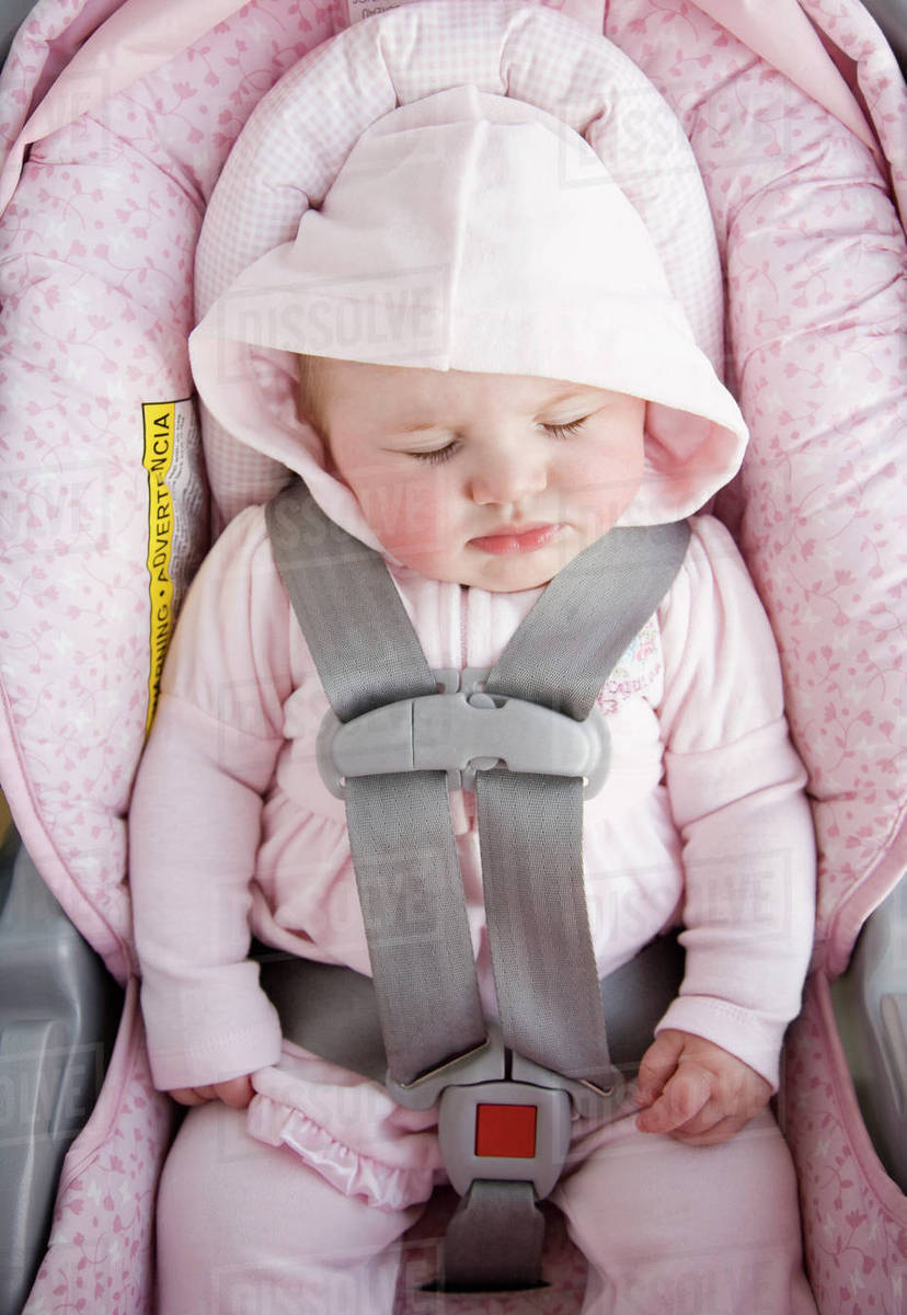 Baby sleeping in car seat Stock Photo Dissolve