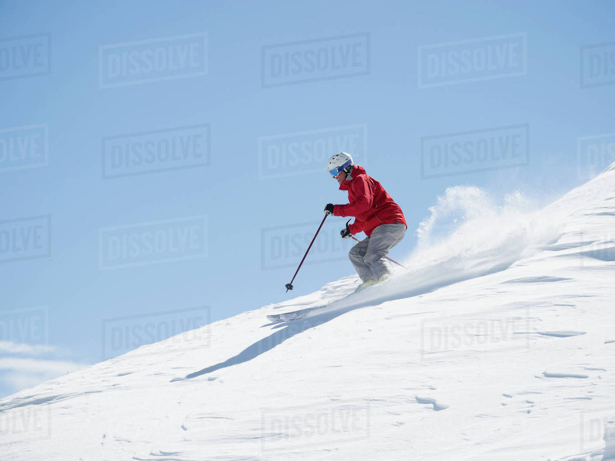 Man skiing downhill Stock Photo Dissolve