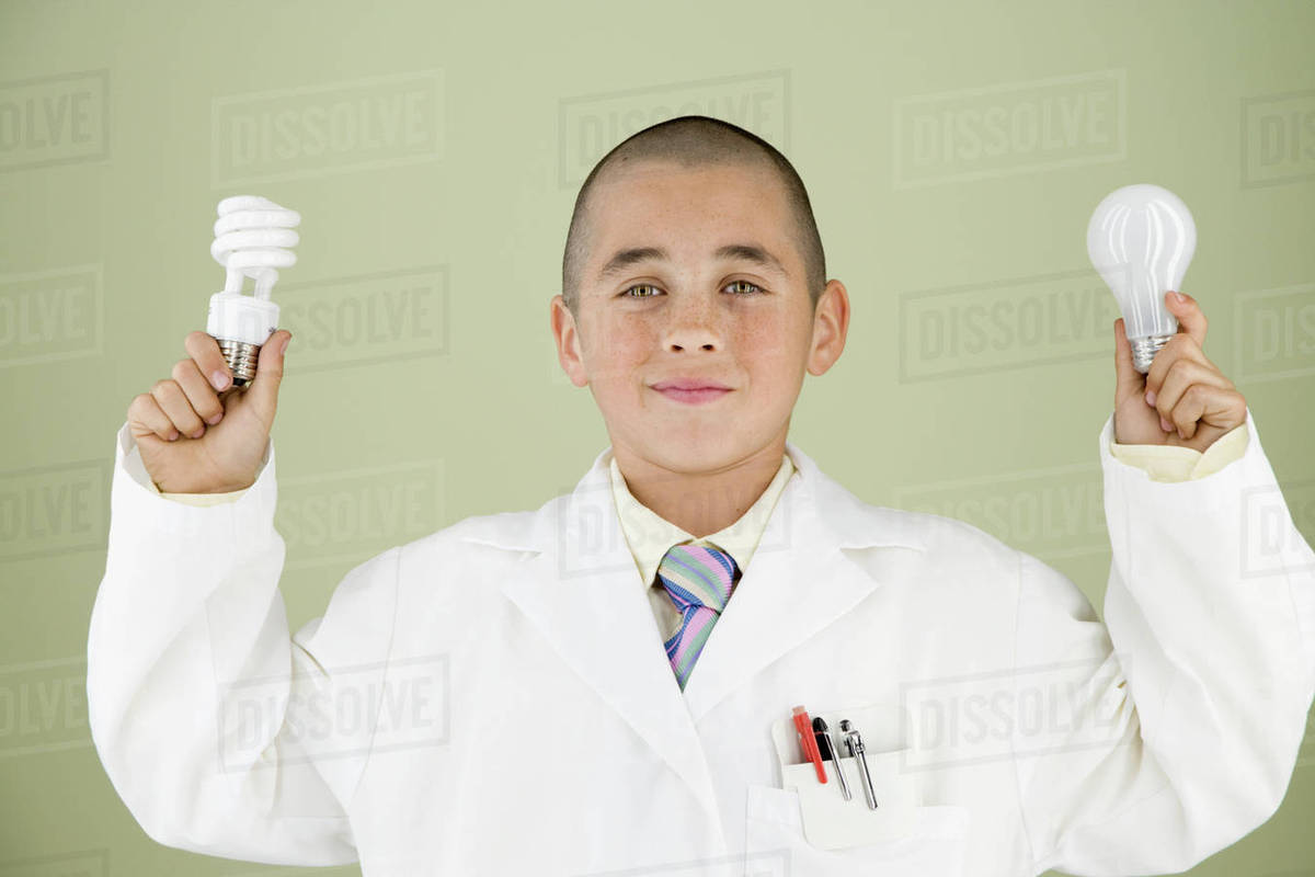 Boy holding light bulbs Stock Photo Dissolve