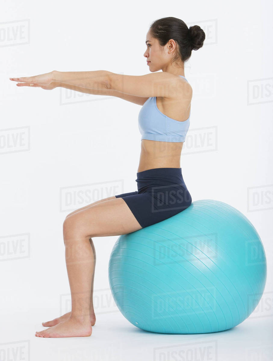 Woman sitting on exercise ball Royalty-free Stock Photo Dissolve