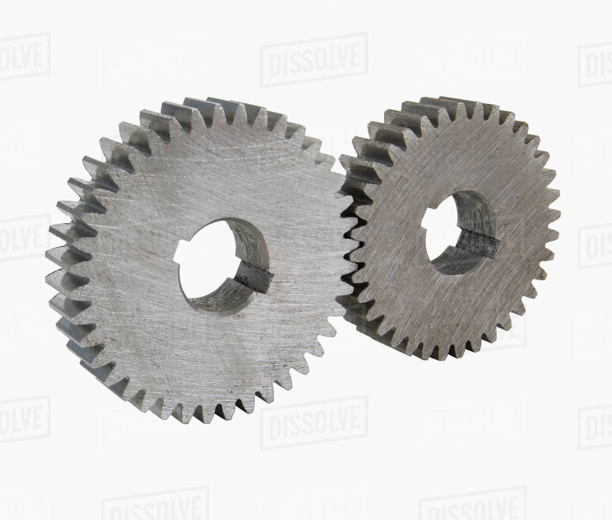 Close up of two cog wheels Stock Photo Dissolve
