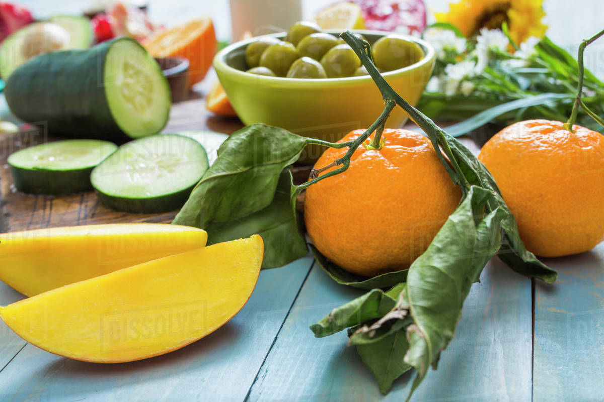 Fresh mangoes and oranges Stock Photo Dissolve