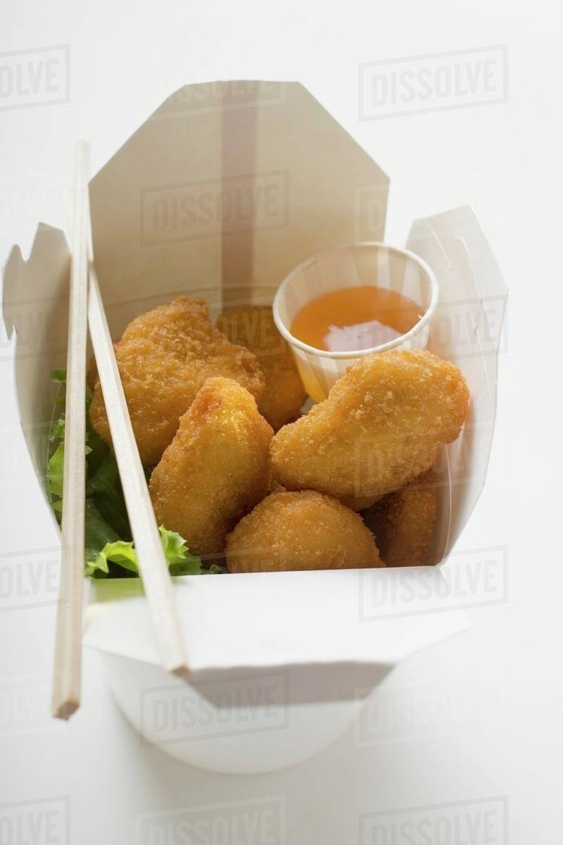 Chicken Nuggets with sweet and sour sauce to take away Stock Photo