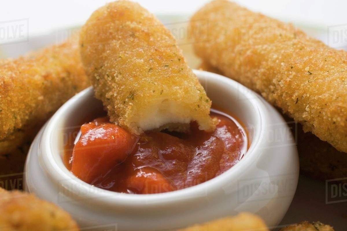 Mozzarella sticks with marinara sauce Stock Photo Dissolve