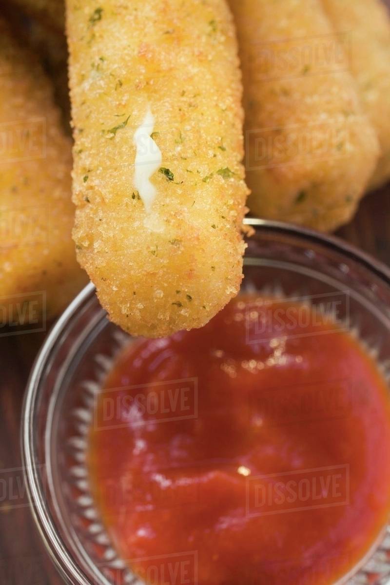 Mozzarella sticks with marinara sauce Stock Photo Dissolve