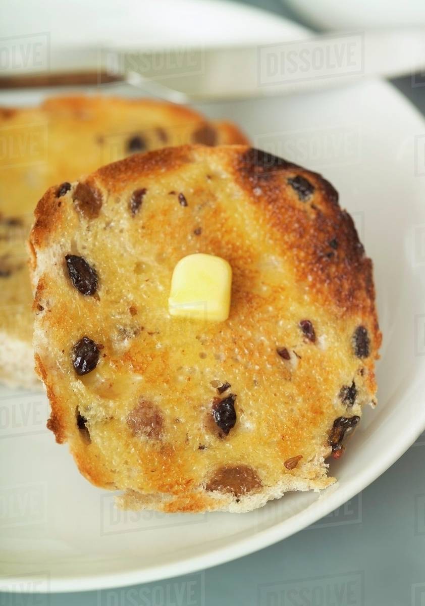 Toasted bun with butter Stock Photo Dissolve