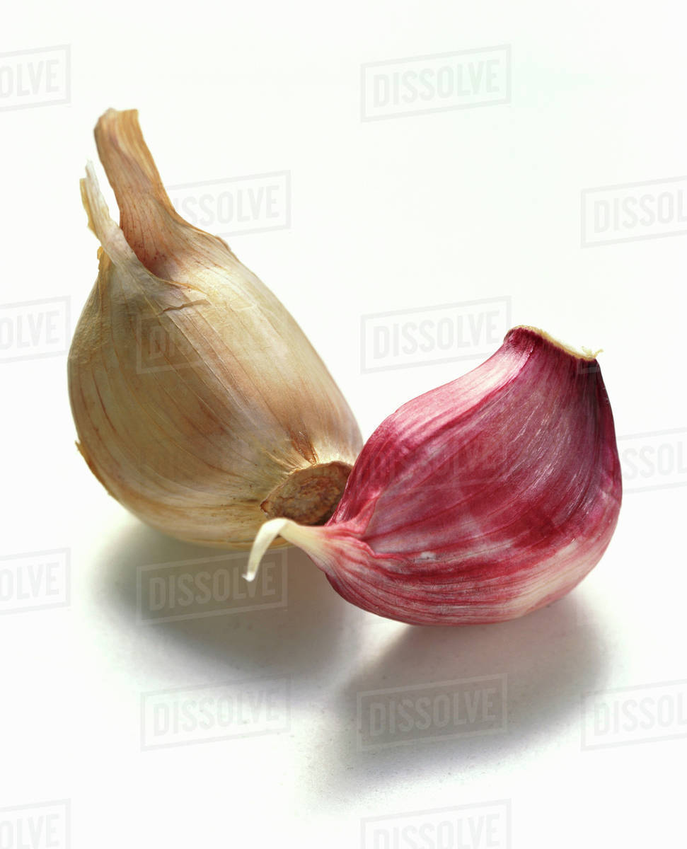 Unpeeled garlic cloves Stock Photo Dissolve