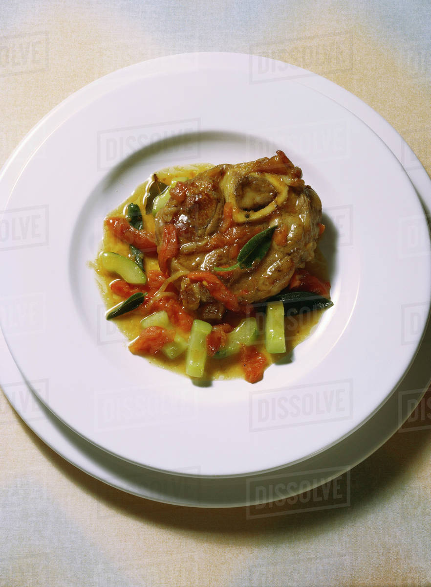 Veal Knuckle Slices with Vegetables Stock Photo Dissolve