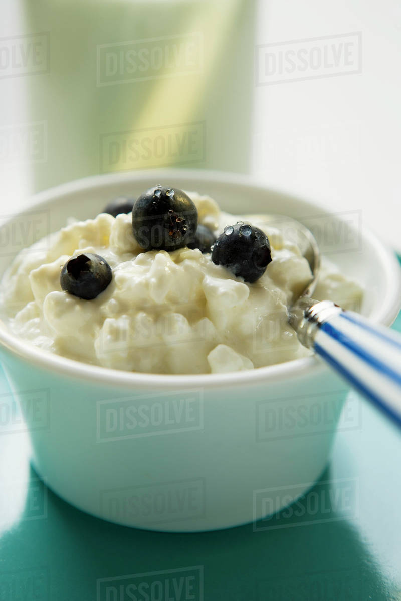 Cottage Cheese With Blueberries And Spoon In A Small Bowl Stock