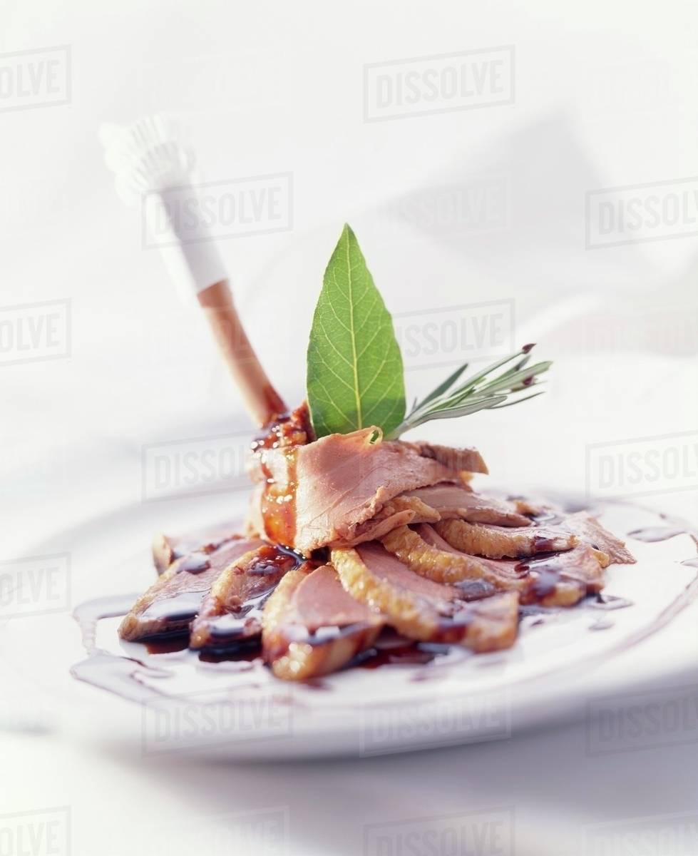 Duck Leg With Balsamic Red Wine Sauce And Herbs Stock Photo