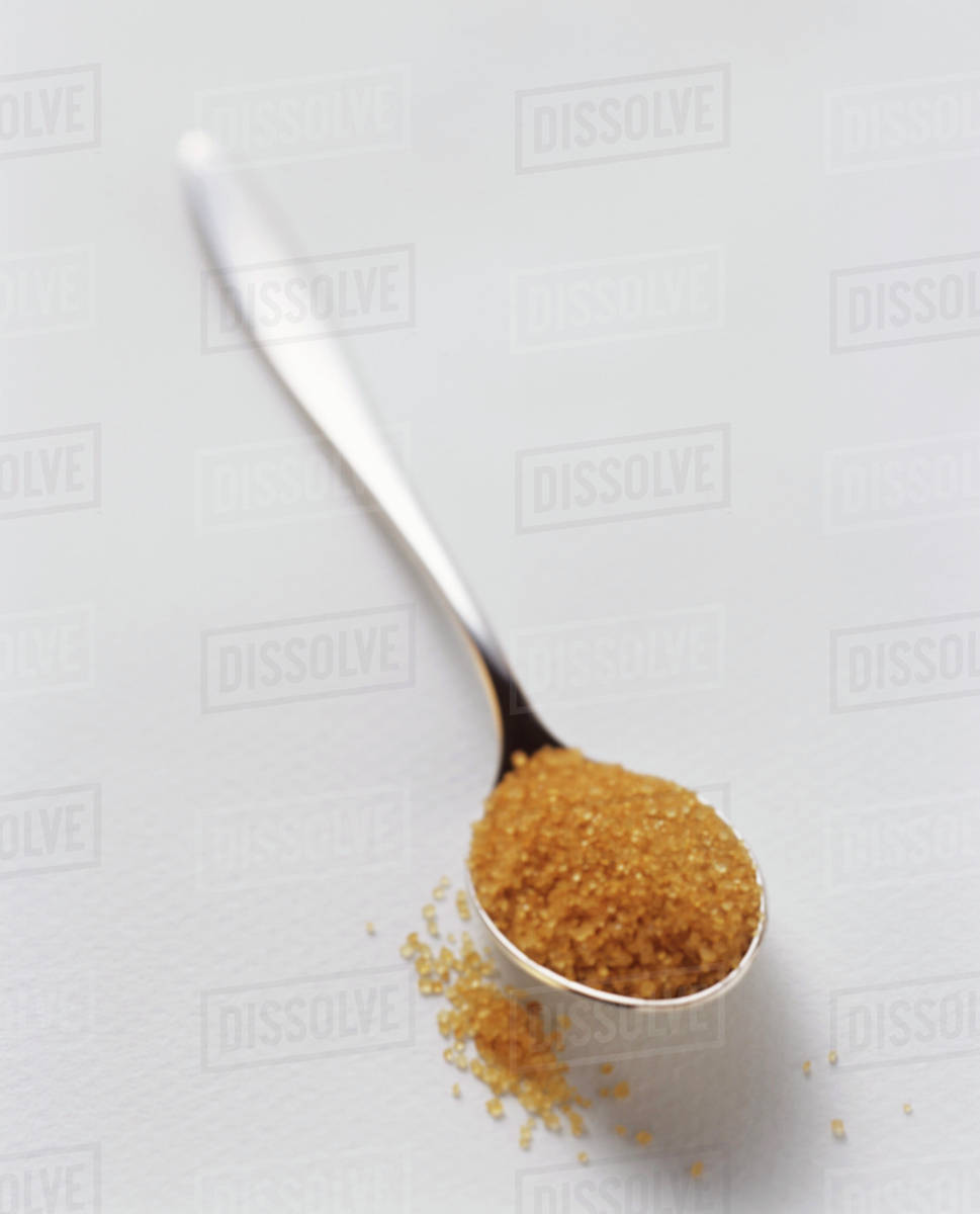 Brown Sugar on a Teaspoon Stock Photo Dissolve