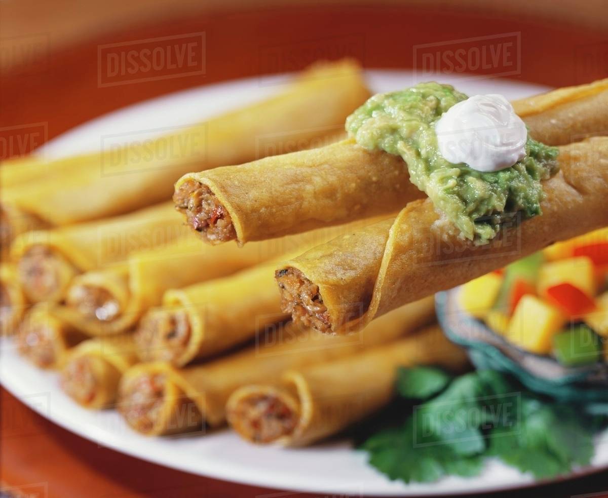 Taquitos with Guacamole Stock Photo Dissolve