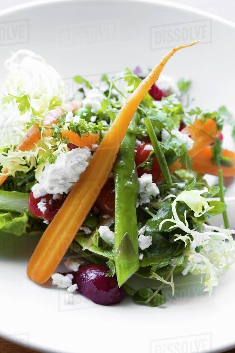 Frisee Salad with Carrots, Asparagus, Beets and Feta Stock Photo