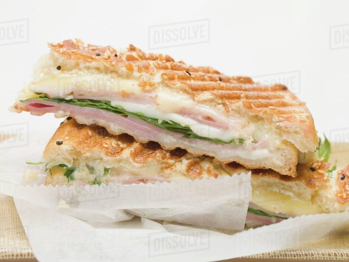 Toasted flatbread with cheese and ham filling Stock Photo Dissolve