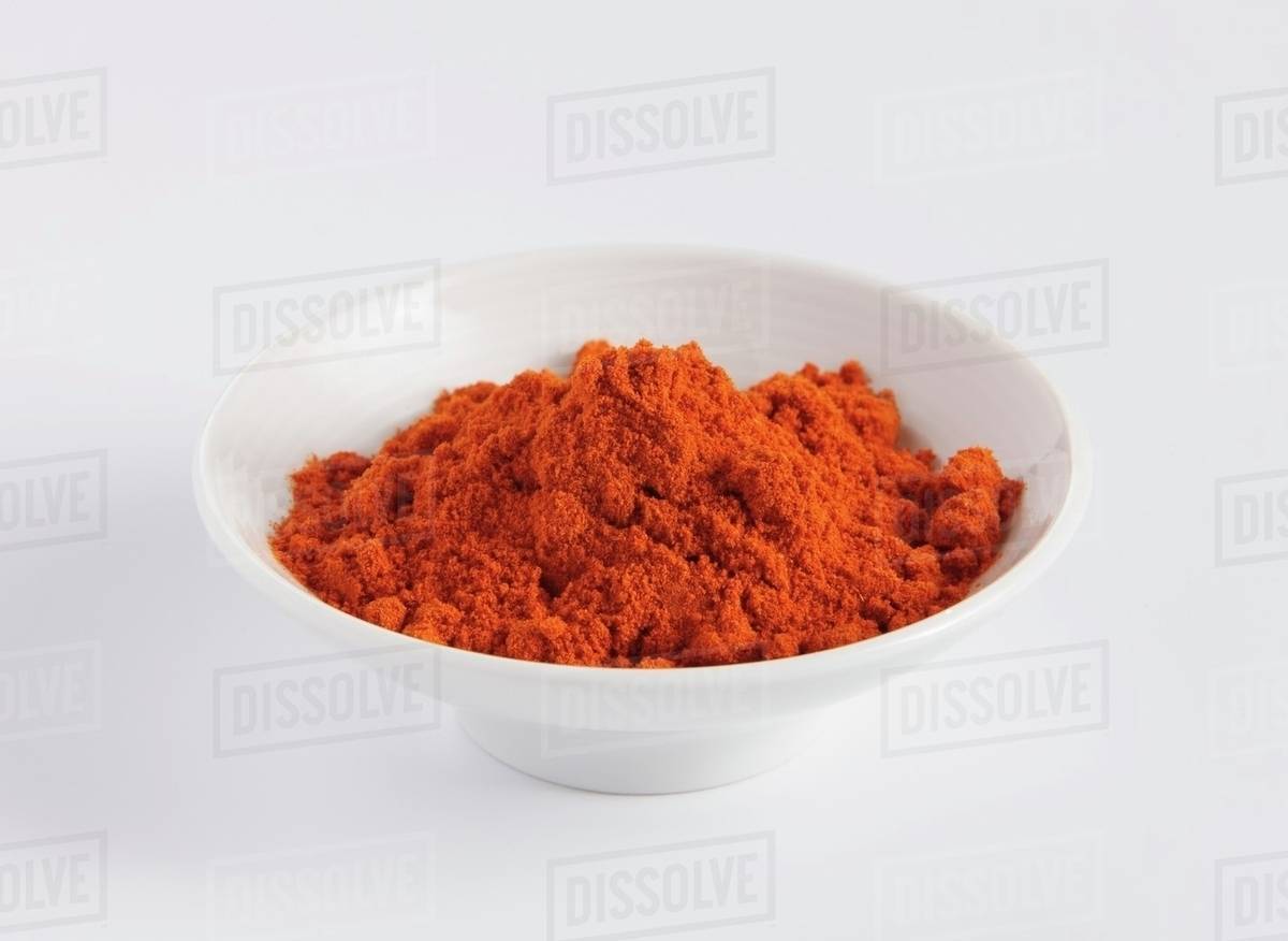 Red curry powder in a porcelain dish Stock Photo Dissolve